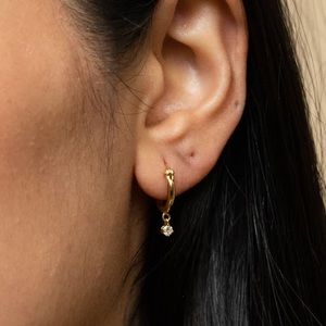 Mejuri white sapphire hoops in gold vermeil.